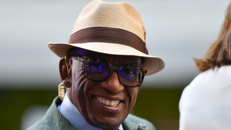 Al Roker smiling in hat and glasses