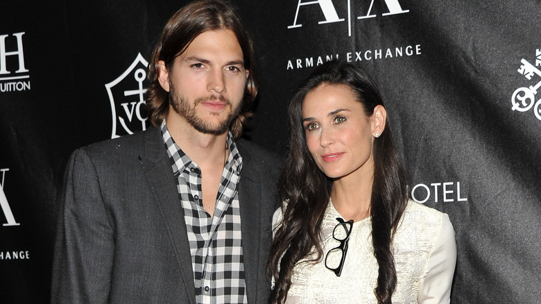 Ashton Kutcher and Demi Moore posing