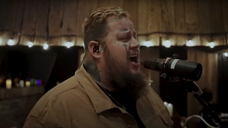 Jelly Roll singing in the music video for his song Save Me