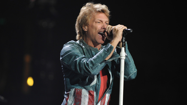 Jon Bon Jovi singing into a mic 