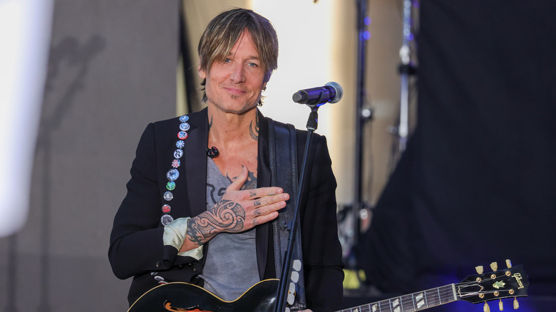 Keith Urban with hand over his heart