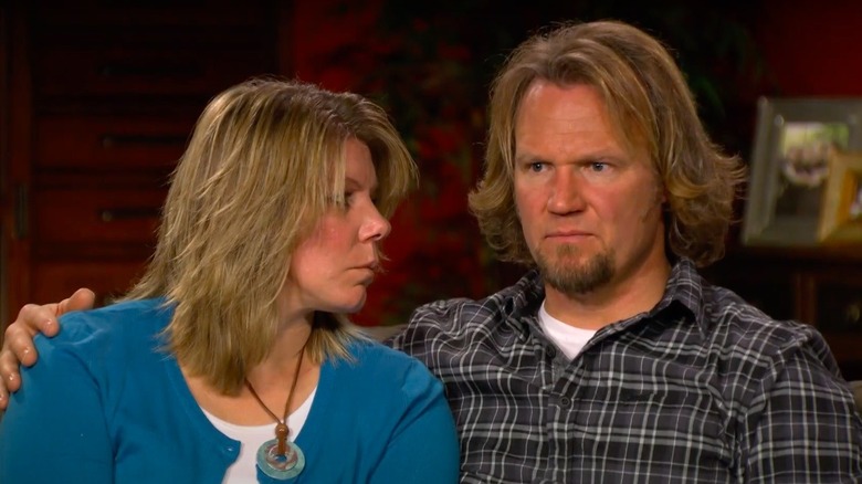 Meri and Kody Brown sitting on a couch in episode of Sister Wives