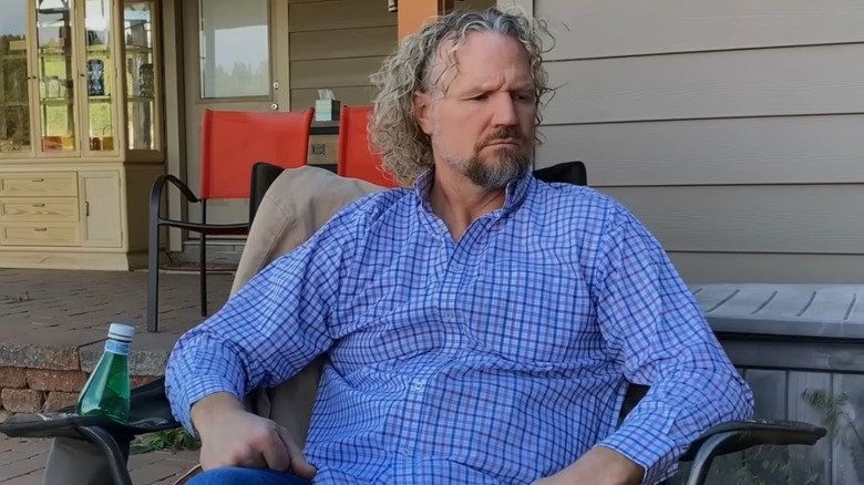 Kody Brown sitting on porch during an episode of Sister Wives