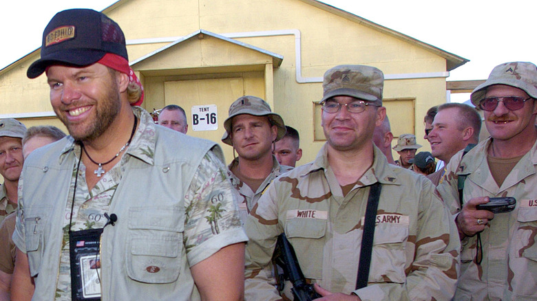 Toby Keith smiling at a military base in Afghanistan