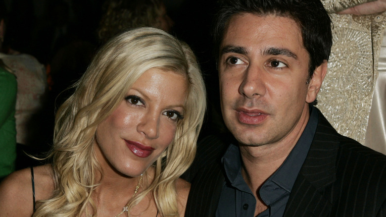 Tori Spelling and Charlie Shahnaian striped suit