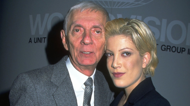 Aaron Spelling and Tori Spelling posing together