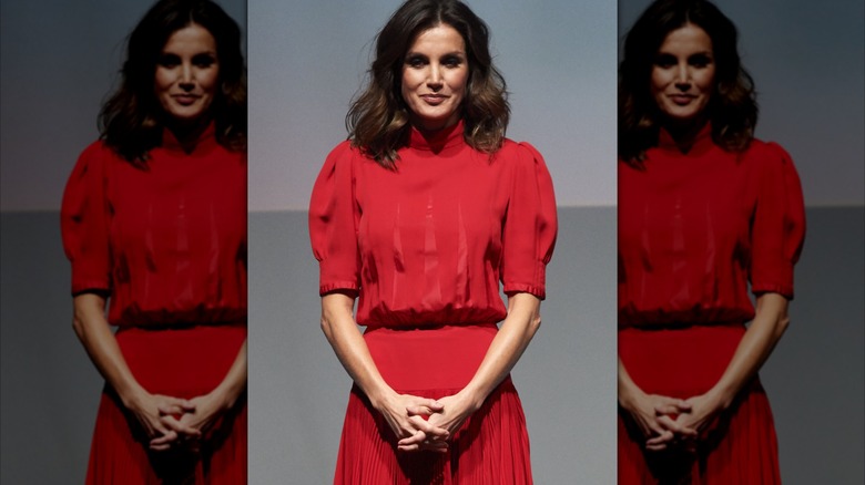 Queen Letizia of Spain weas a red dress to the Spanish fashion awards