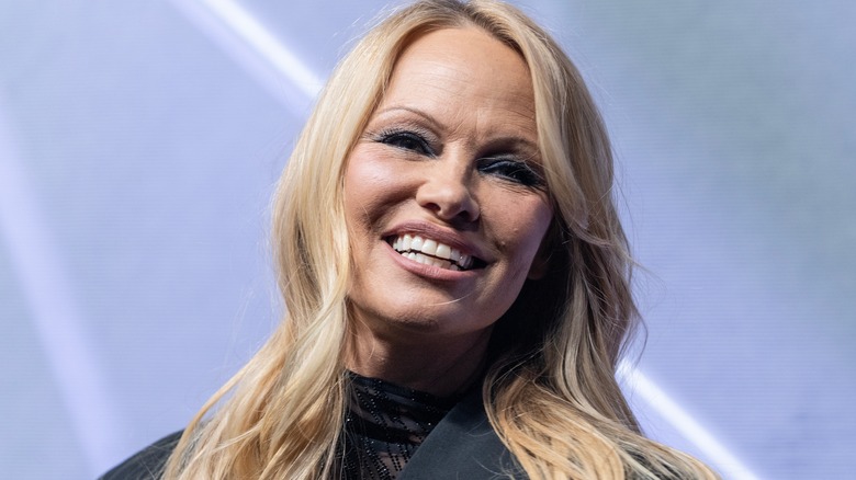 Pamela Anderson smiling at event