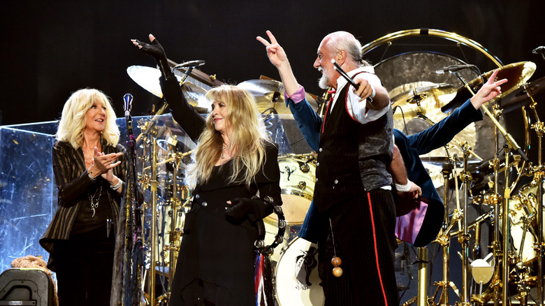 Christine McVie, Stevie Nicks, and Mick Fleetwood on stage