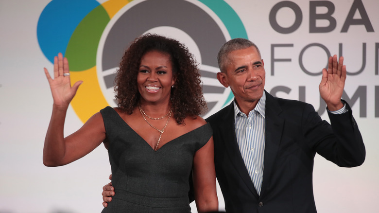 Barack and Michelle Obama waving