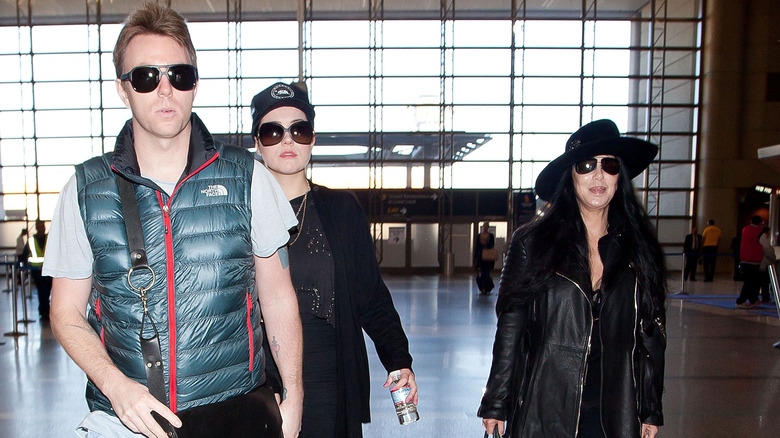 Cher and Elijah Blue Allman walking through LAX