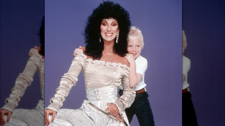 Toddler Elijah Blue Allman hugging Cher