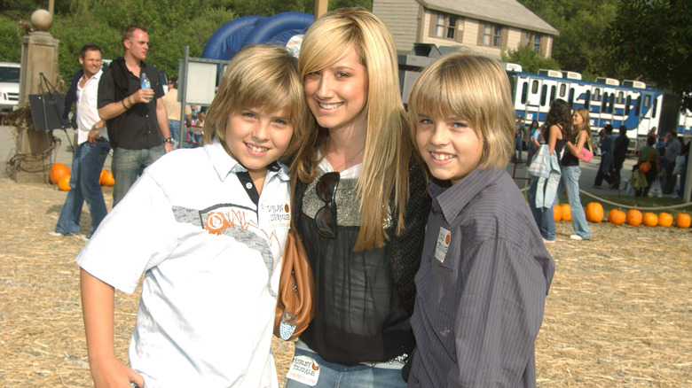 Dylan Sprouse, Ashley Tisdale, and Cole Sprouse smiling