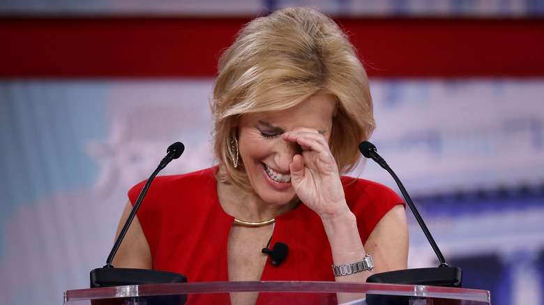 Laura Ingraham laughing while speaking at an event