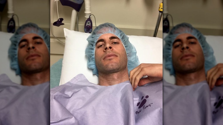 Tarek El Moussa in a hospital bed