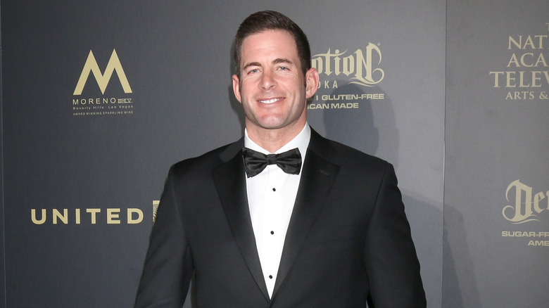 Tarek El Moussa posing at an event