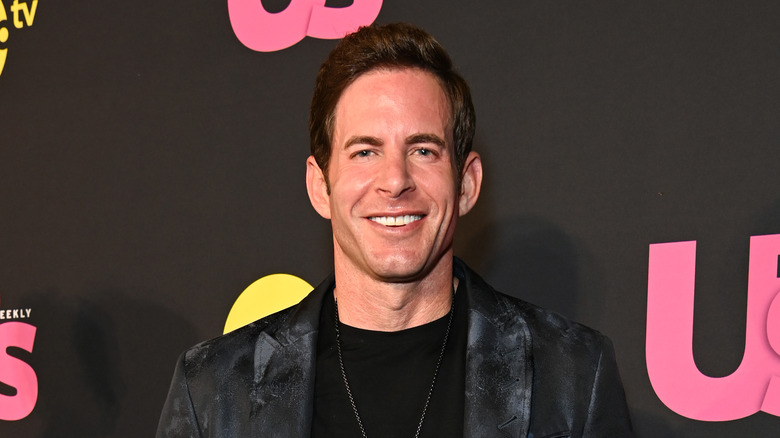 Tarek El Moussa posing at an event