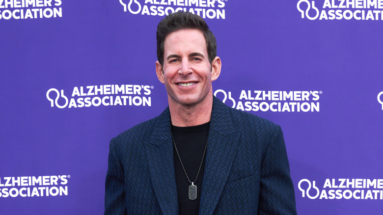 Tarek El Moussa posing at an event