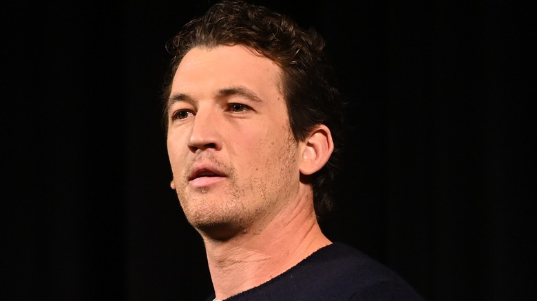 Miles Teller black background