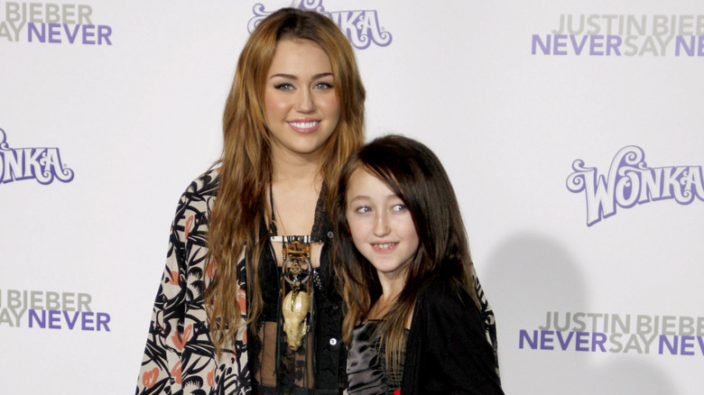 Noah and Miley Cyrus smiling