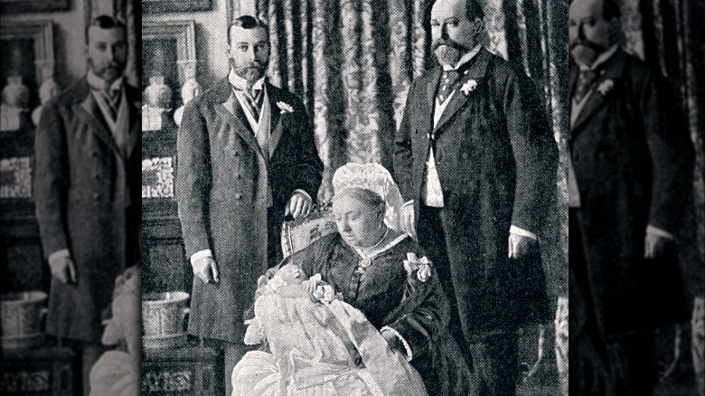 Queen Victoria with family holding baby