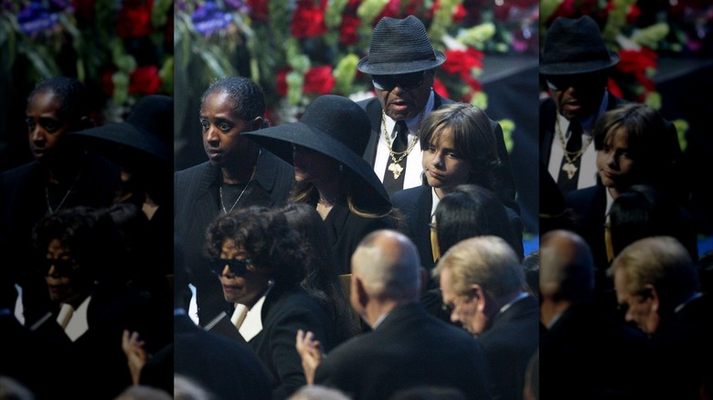 Prince Jackson with Joe Jackson at his father's funeral