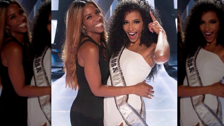 April Simpkins & Cheslie Kryst posing on Miss USA stage