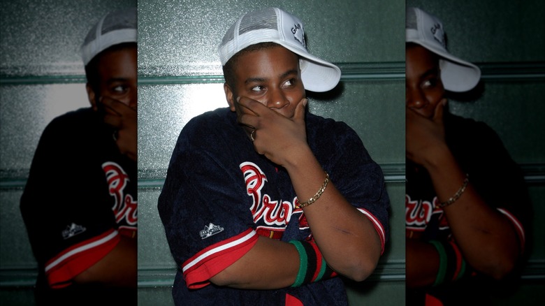 Kenan Thompson posing in a hat at a "Saturday Night Live" after party in 2003