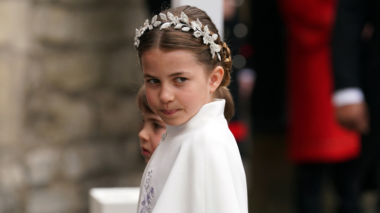 Princess Charlotte frowning at King Charles' coronation