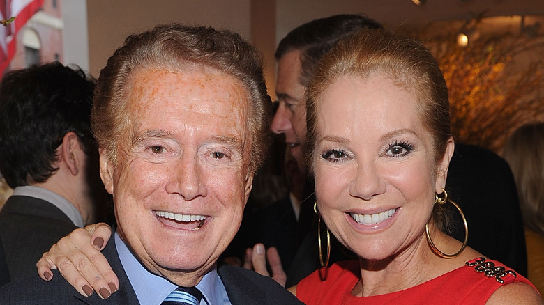 Kathie Lee Gifford posing with Regis Philbin