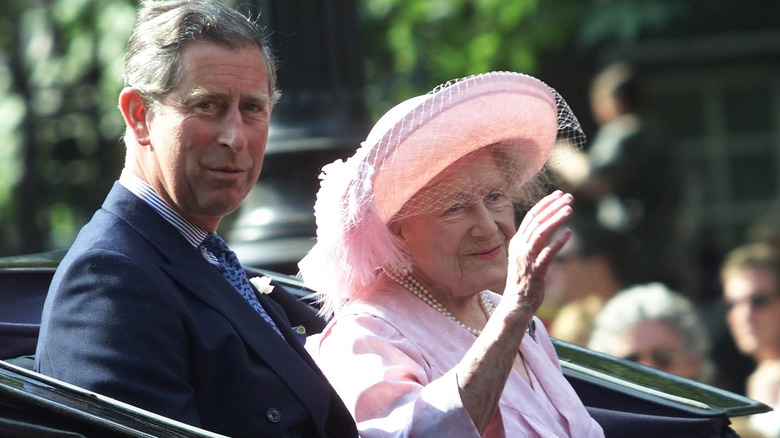 Prince Charles, the Queen Mother waving