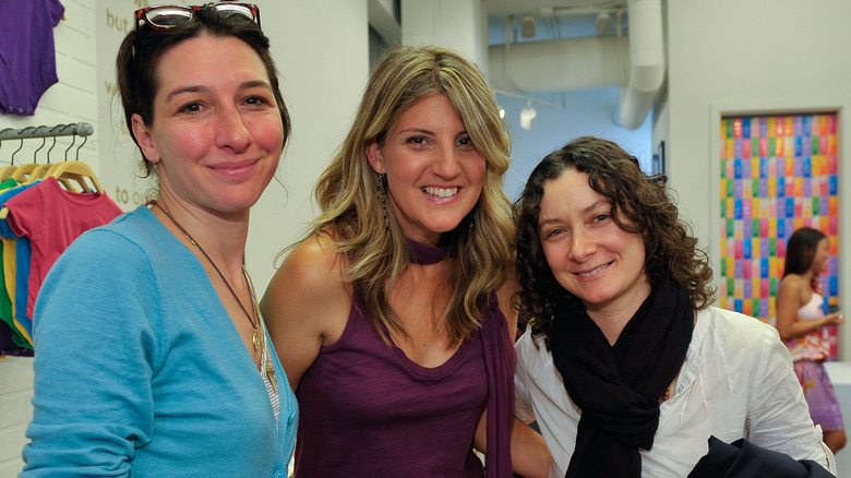 Sara Gilbert and Allison Adler posing with Paige Tolmach