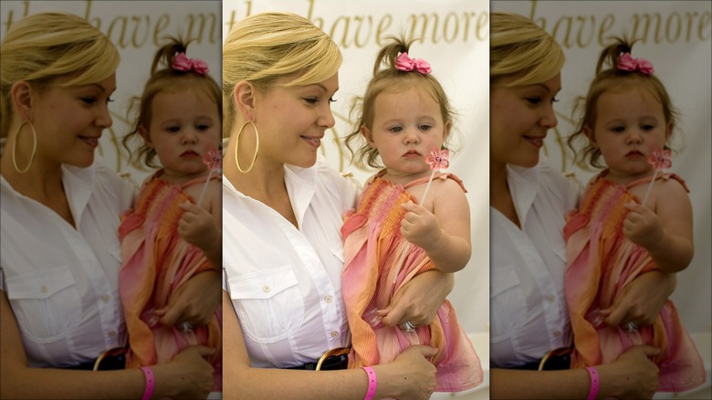 Shanna Moakler holding her daughter 