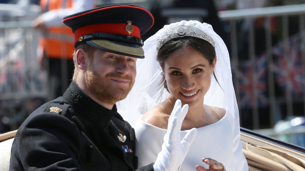 Meghan, Duchess of Sussex, and Prince Harry smiling on their wedding day