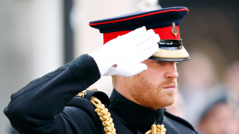 Prince Harry saluting in his royal military outfit