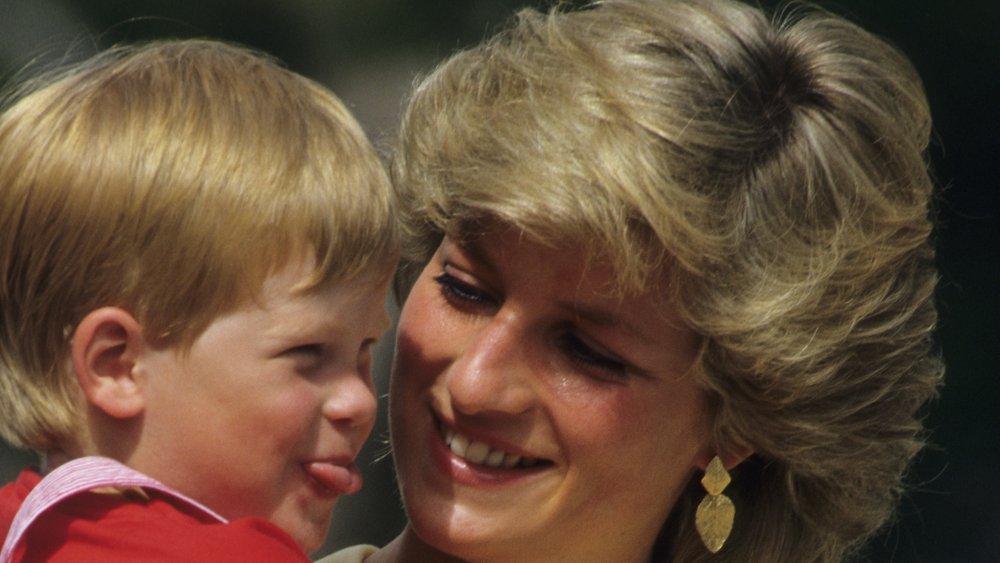 Prince Harry as a toddler sticking his tongue out at mom Princess Diana