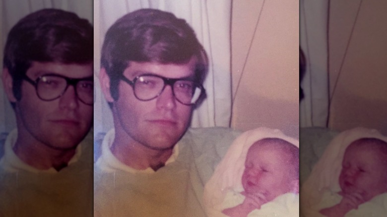 Ainsley Earhardt as a baby being held by her father