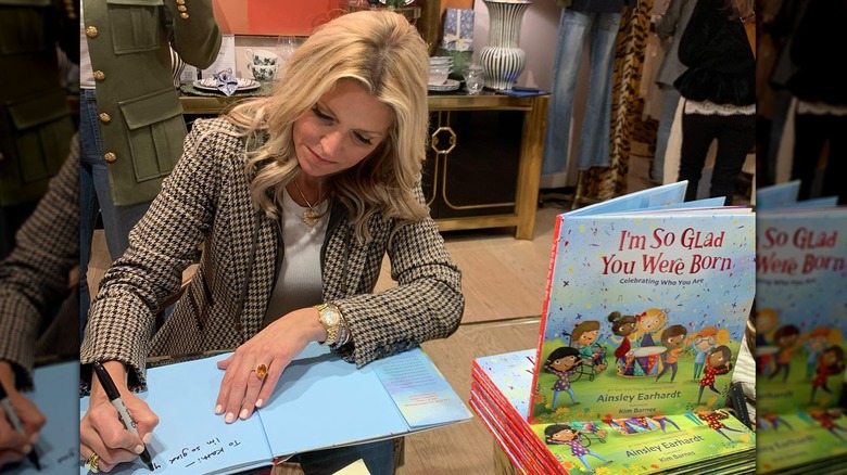 Ainsley Earhardt signing a book