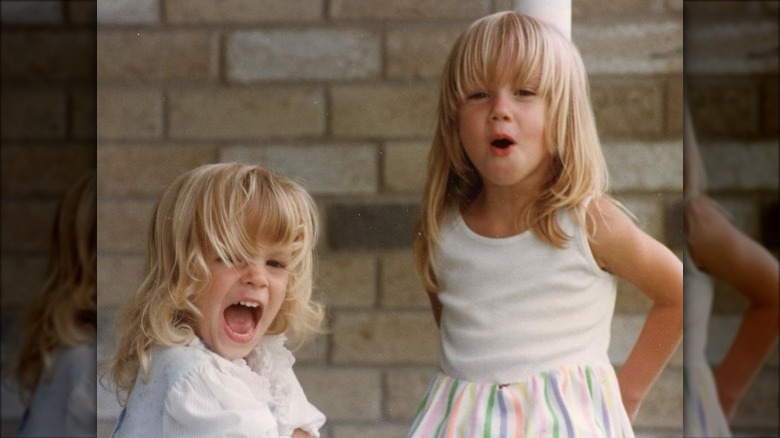 Young Amber Heard with her sister