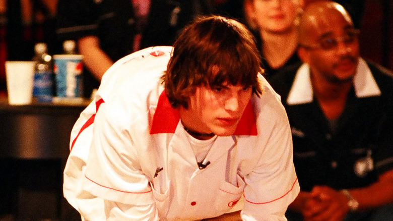 Ashton Kutcher bowling on set