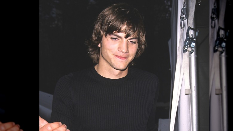 Ashton Kutcher looking down