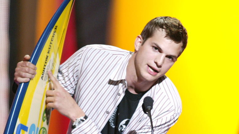 Ashton Kutcher with surfboard