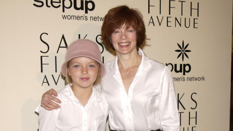 Francesca Eastwood posing with mom Frances Fisher at an event