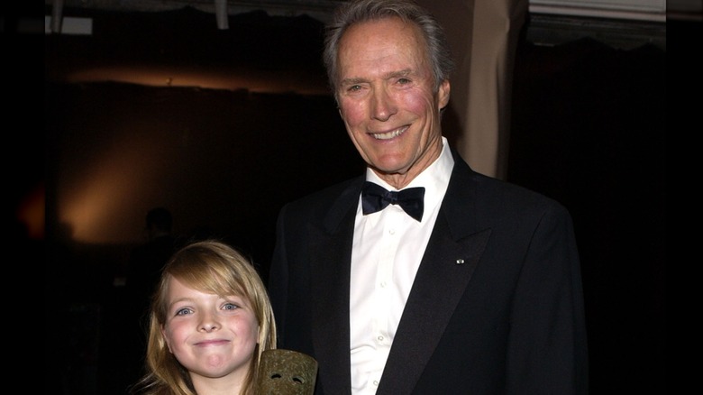 Clint Eastwood smiling next to his young daughter