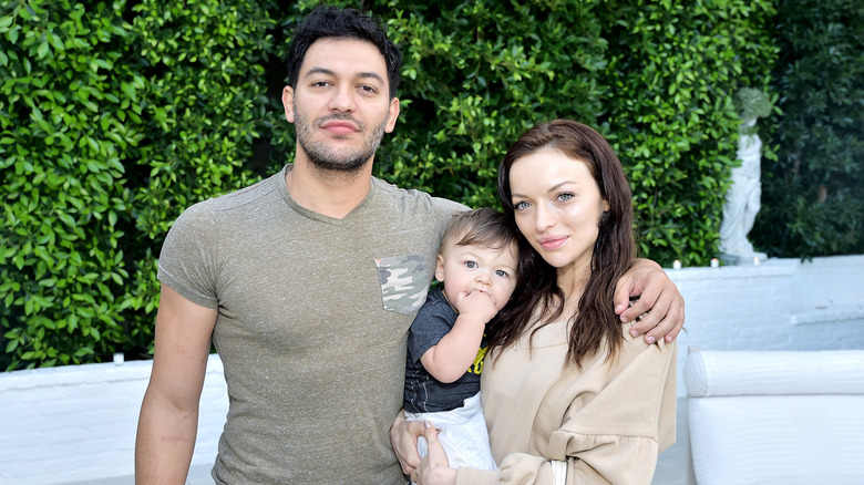 Francesca Eastwood posing with Alexander Wraith and son Titan