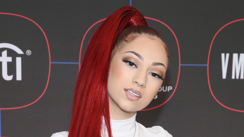 Bhad Bhabie posing with a high ponytail at a press event