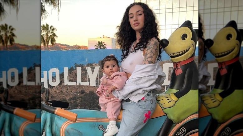 Bhad Bhabie sitting on a ride with Kali Rose