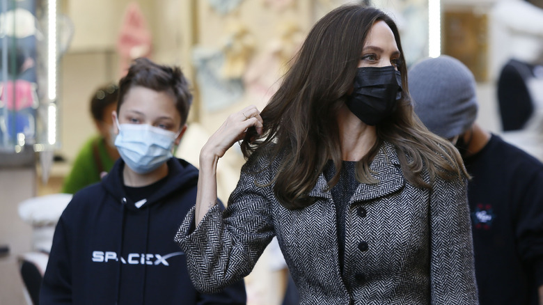 Knox Jolie-Pitt and Angelina Jolie walking in Rome wearing face masks