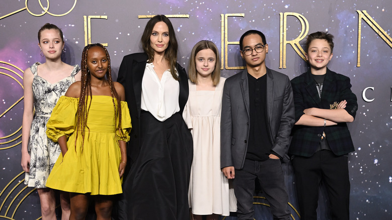 Angelina Jolie posing with kids at Eternal premiere