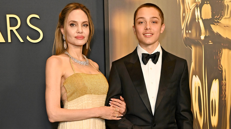 Angelina Jolie and Knox Jolie-Pitt posing on red carpet